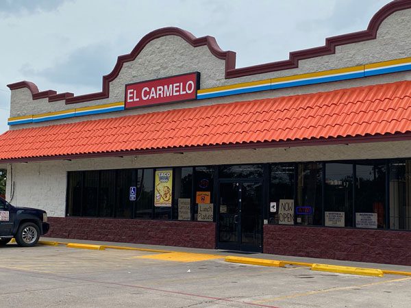 Large building with words El Carmelo, opening up business alamo